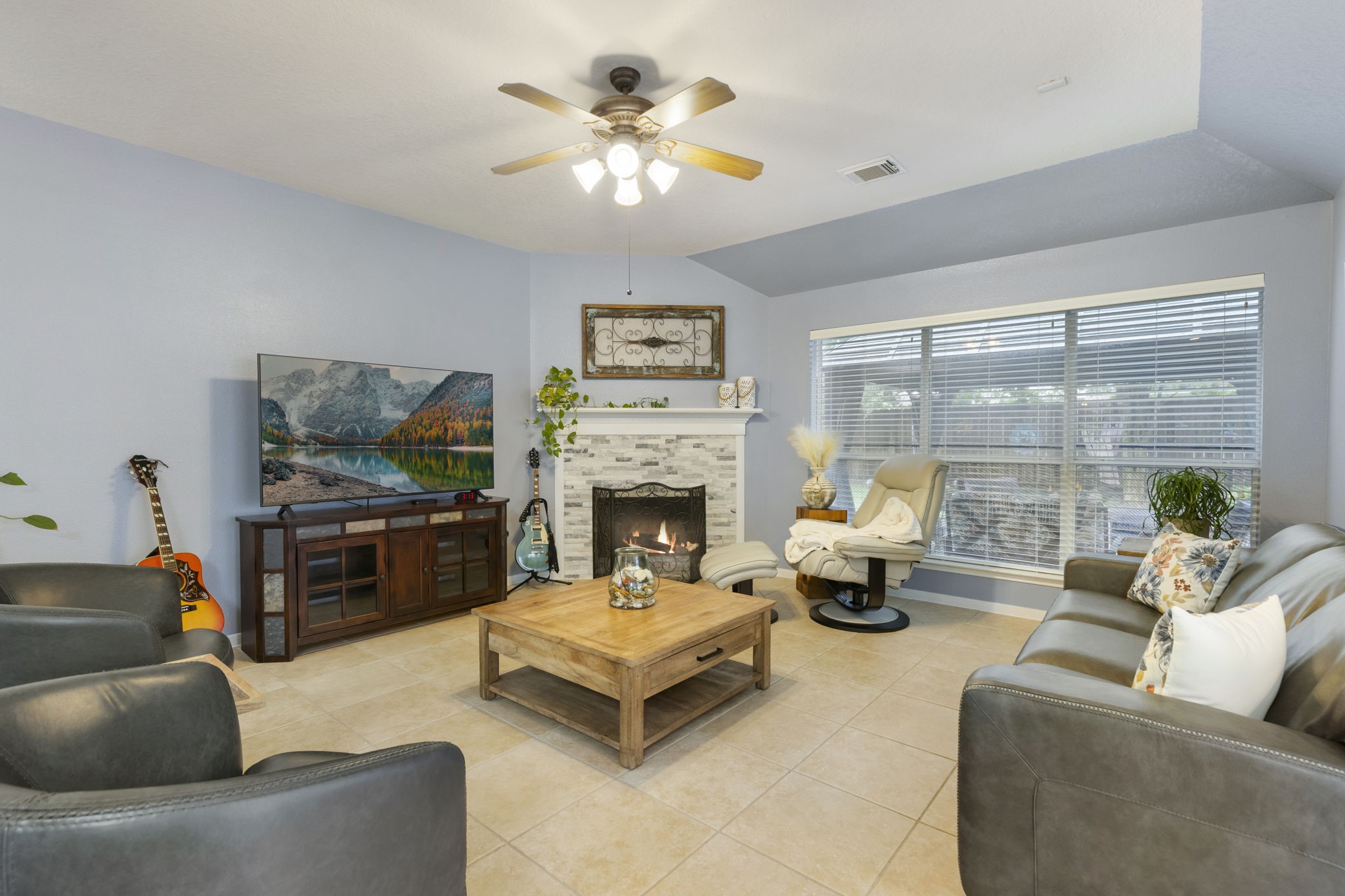 20019 Hardsville Drive Spring, TX 77388 - Photo 12 of 28 a living room with furniture a fireplace and a flat screen tv