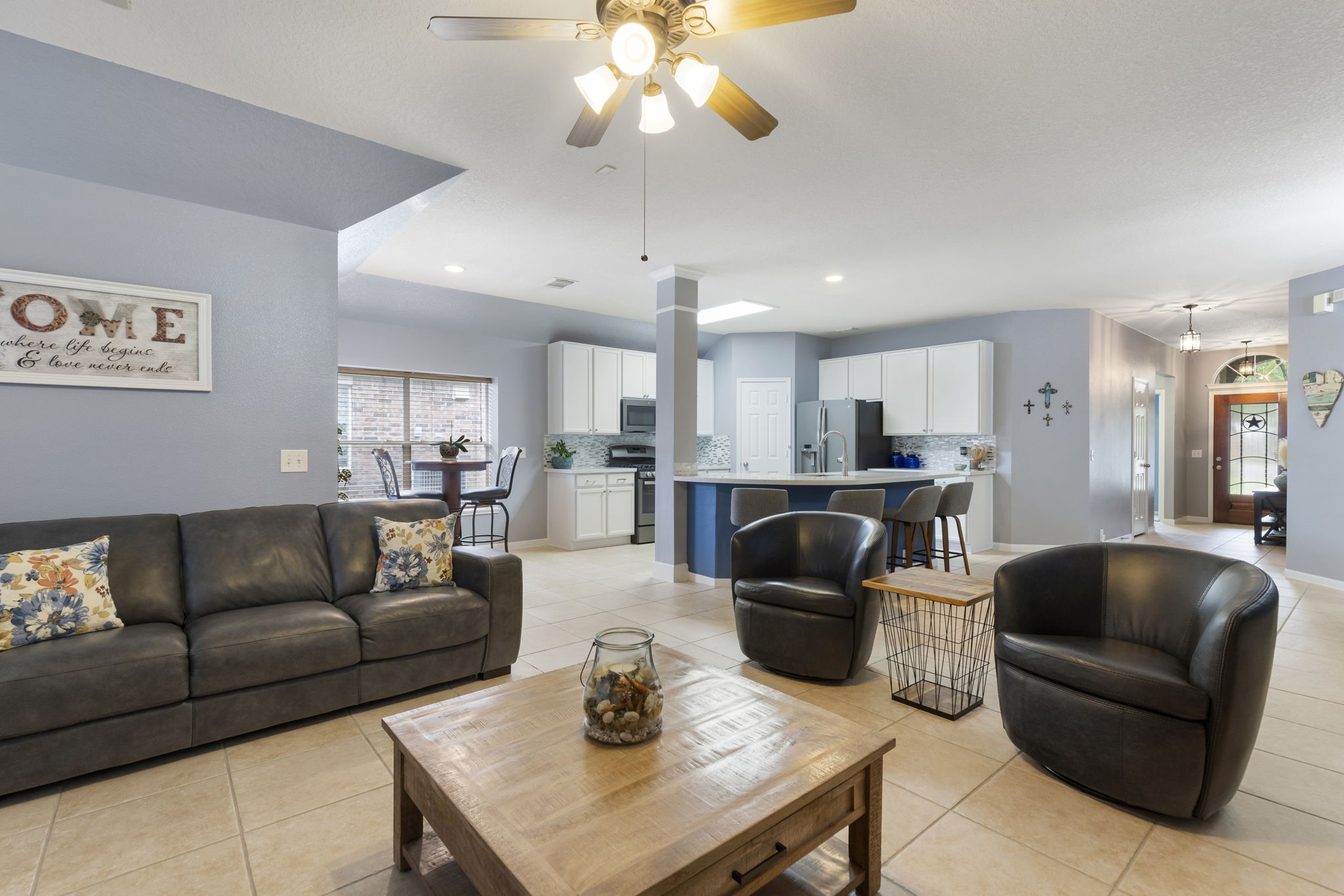 20019 Hardsville Drive Spring, TX 77388 - Photo 14 of 28 a living room with furniture kitchen and a chandelier
