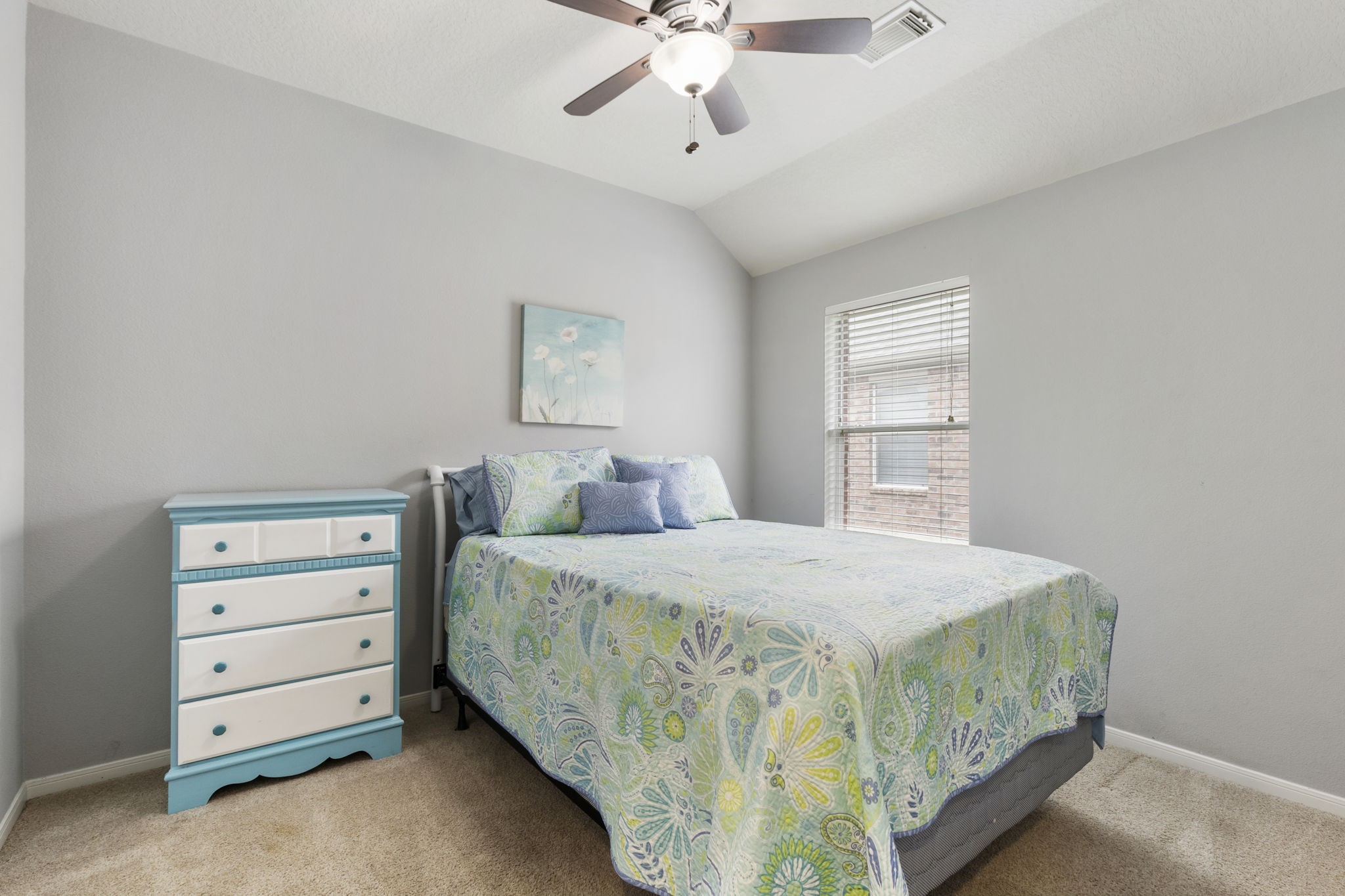 20019 Hardsville Drive Spring, TX 77388 - Photo 21 of 28 a bedroom with a bed and a chandelier