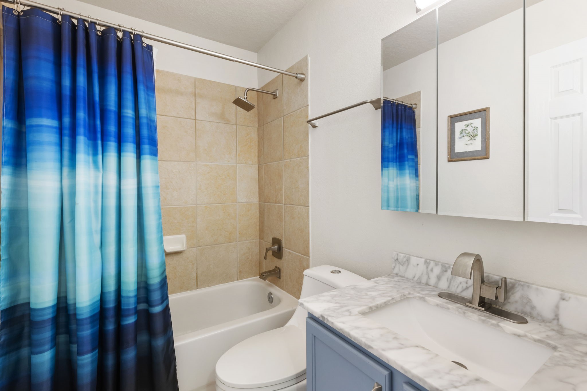 20019 Hardsville Drive Spring, TX 77388 - Photo 22 of 28 a bathroom with a granite countertop sink a toilet and shower