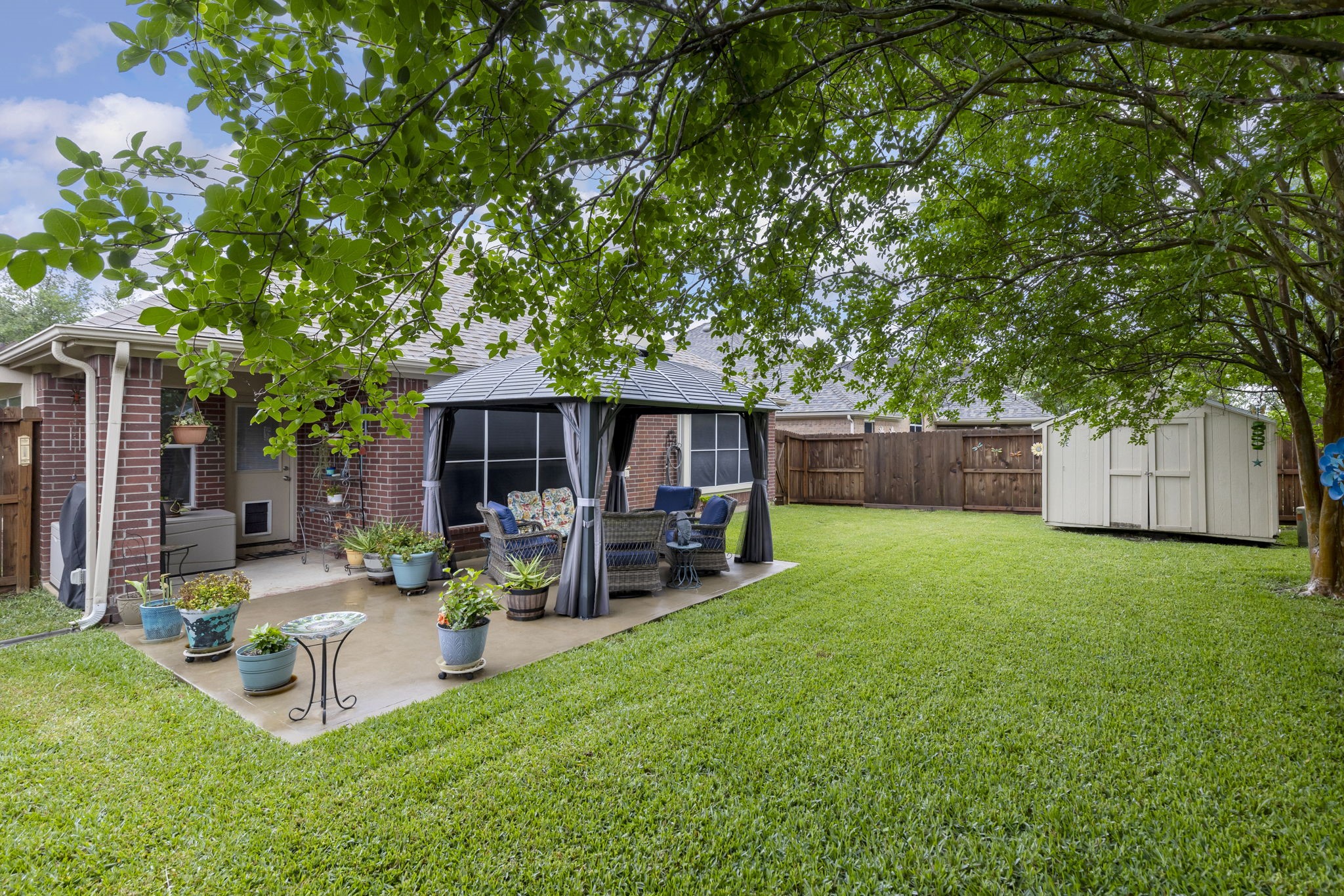 20019 Hardsville Drive Spring, TX 77388 - Photo 26 of 28 a view of a house with backyard porch and sitting area