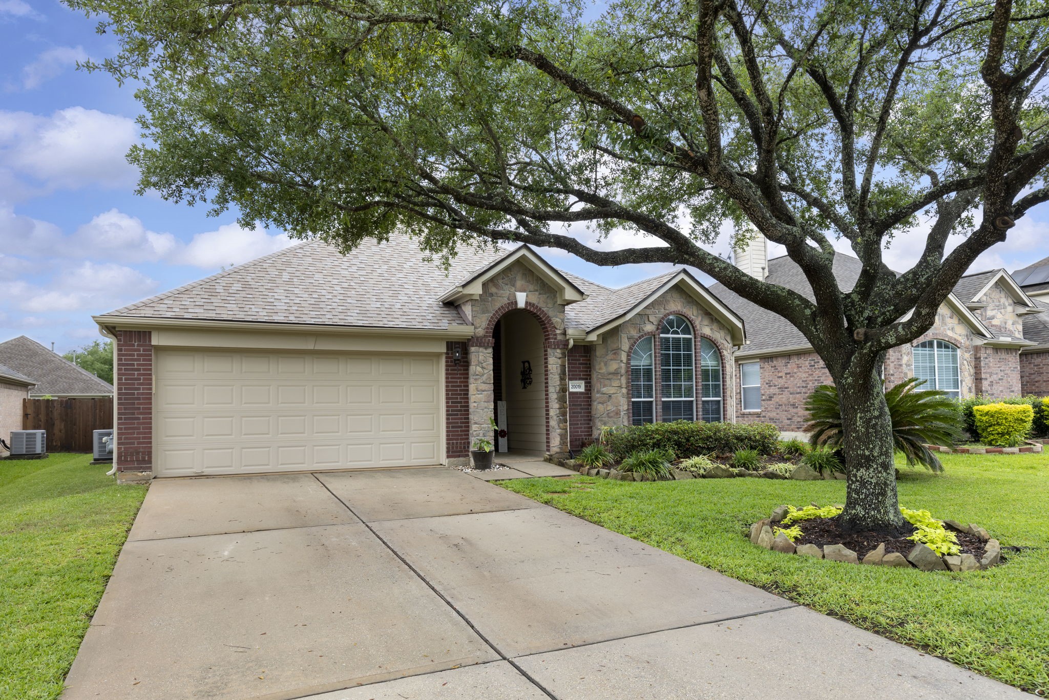 20019 Hardsville Drive Spring, TX 77388 - Photo 3 of 28 a front view of house with yard and green space