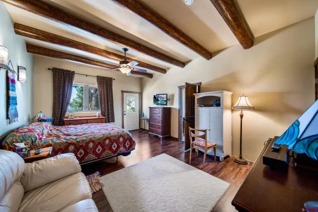 a bedroom with furniture and a chandelier