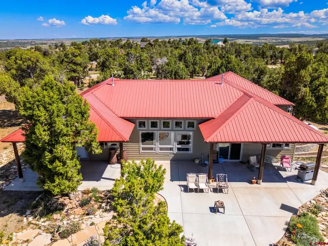 a view of house with outdoor space and swimming pool