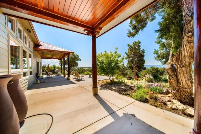 a view of a swimming pool with an outdoor seating