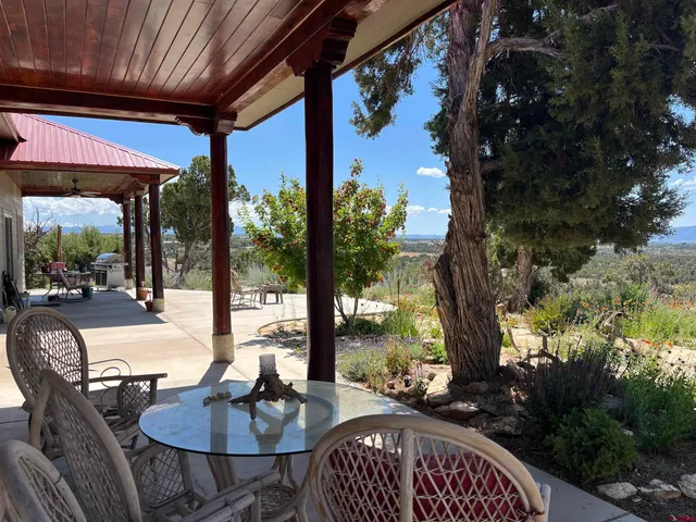 a outdoor space with patio lots of furniture and wooden floor