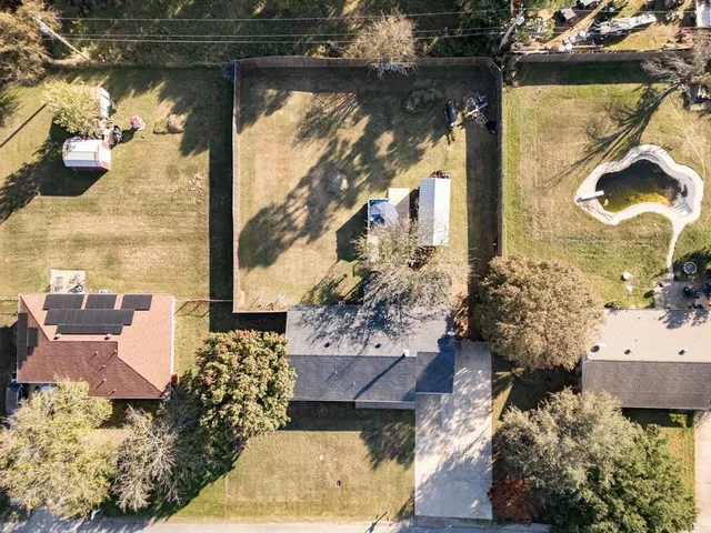 a roof deck with table and chairs and wooden floor