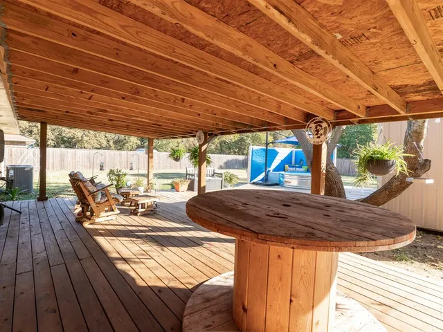 a view of a backyard with sitting area and furniture