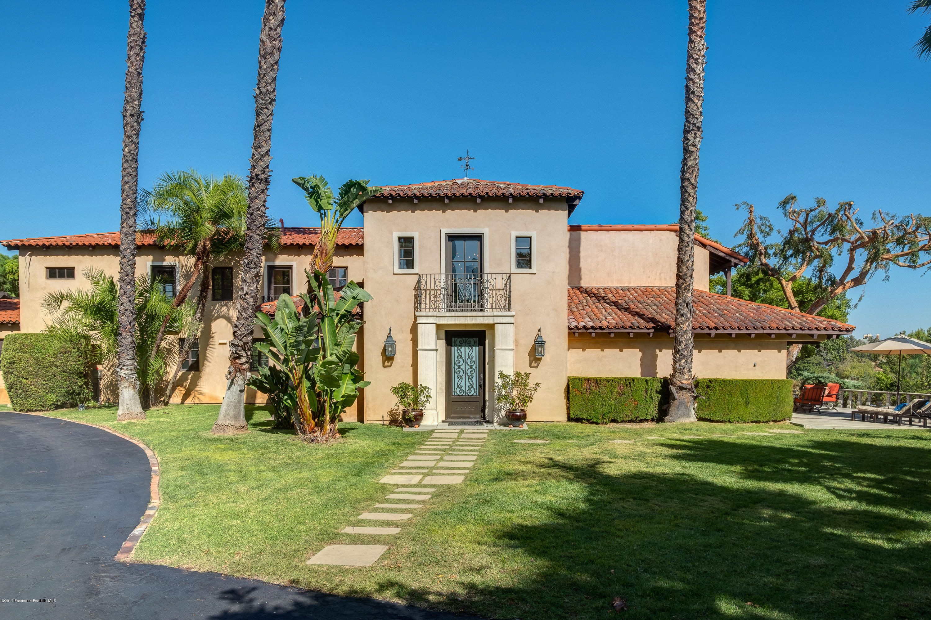 320 Patrician Way Pasadena, CA 91105 - Photo 1 of 69 a front view of a house with a yard
