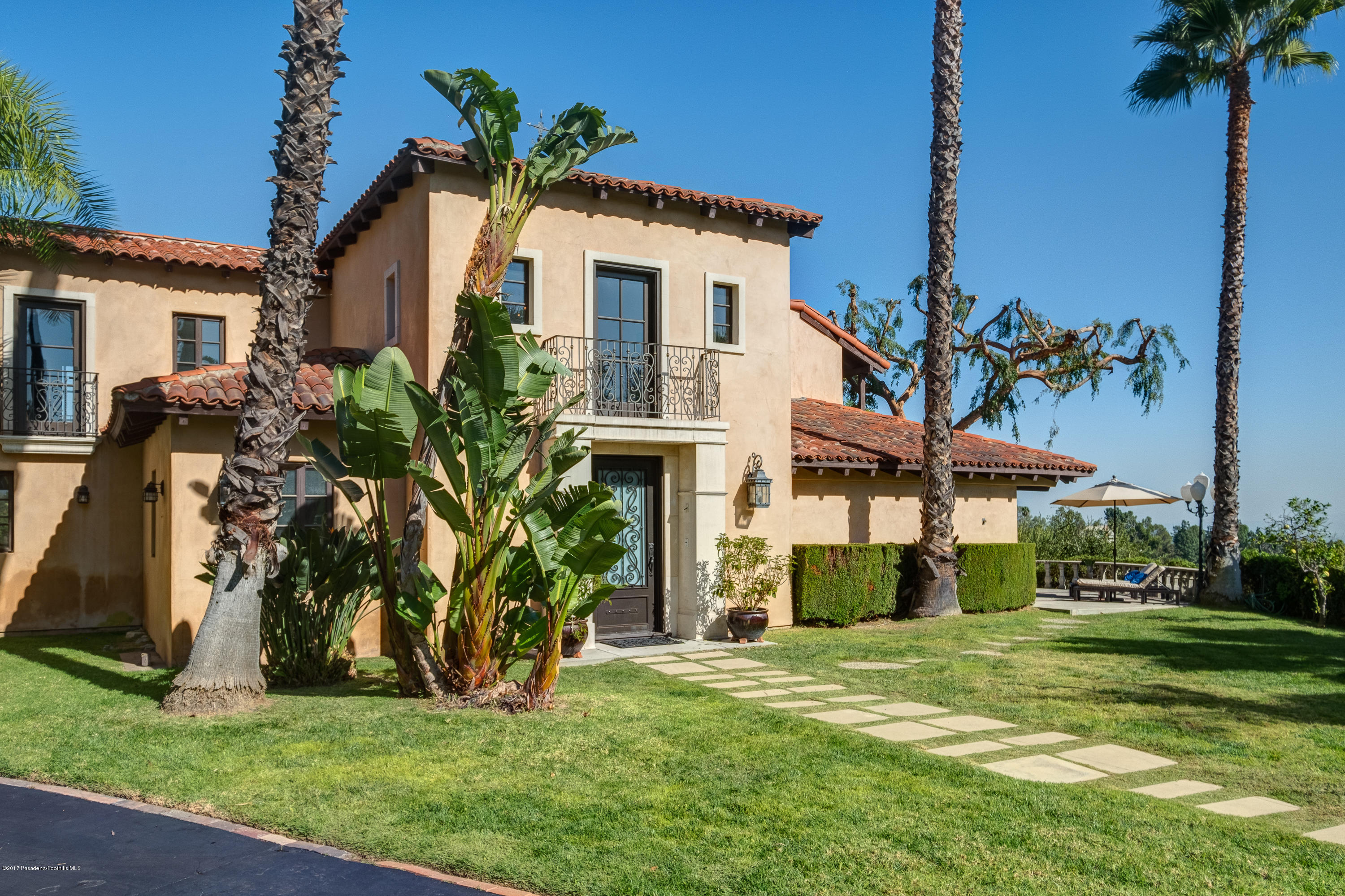 320 Patrician Way Pasadena, CA 91105 - Photo 2 of 69 a front view of a house with garden