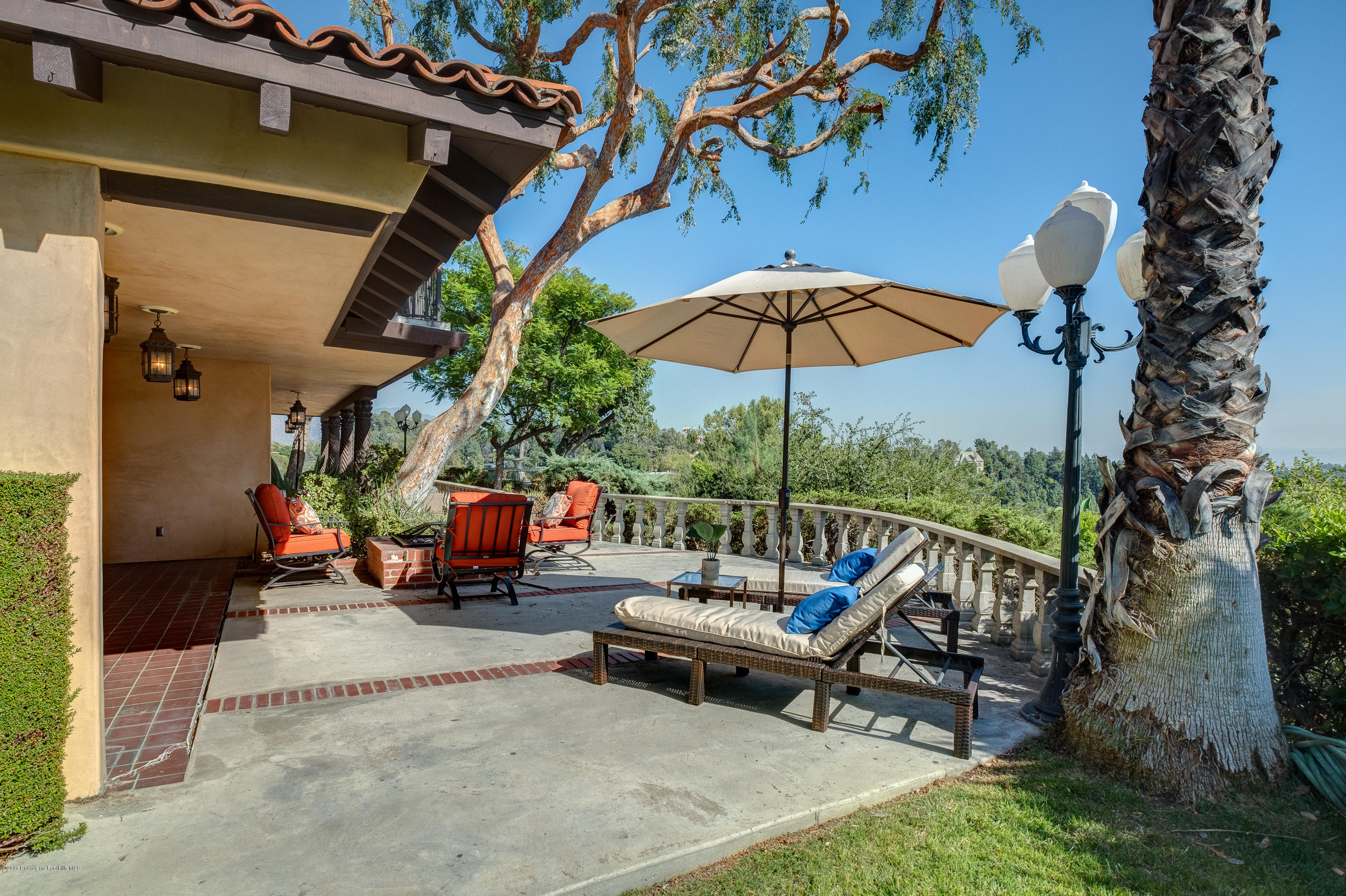 320 Patrician Way Pasadena, CA 91105 - Photo 15 of 69 a view of a chairs and table in the patio