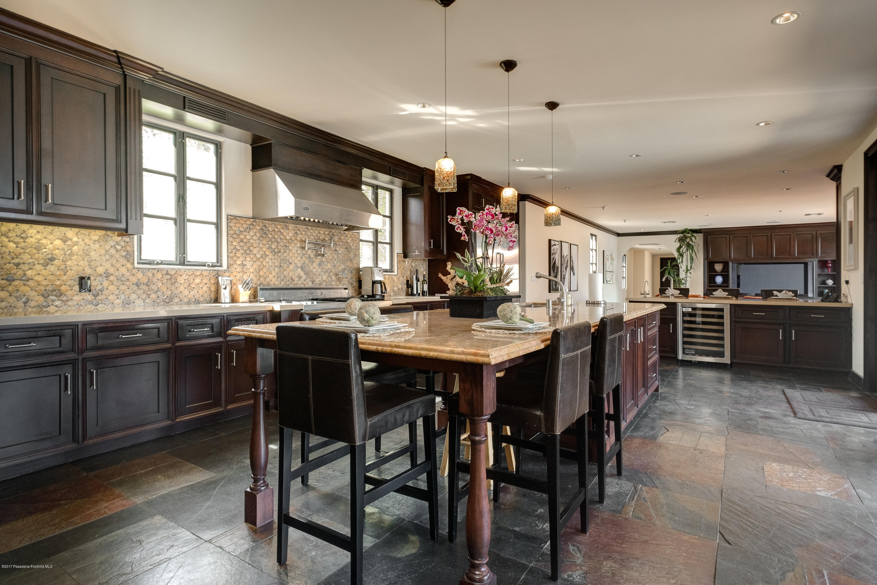 320 Patrician Way Pasadena, CA 91105 - Photo 20 of 69 a kitchen with lots of wooden furniture appliances and furniture