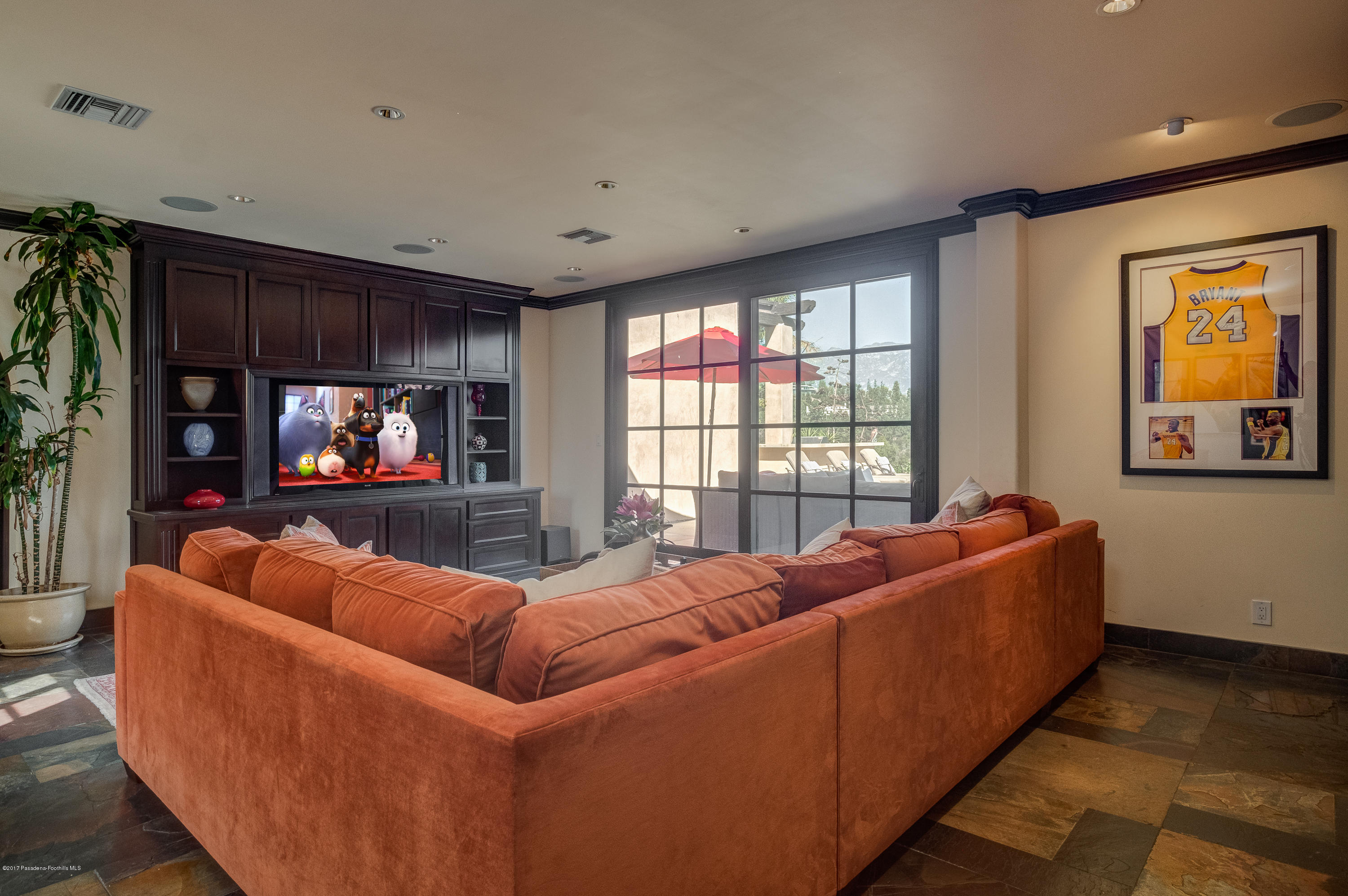 320 Patrician Way Pasadena, CA 91105 - Photo 23 of 69 a living room with furniture and a large window