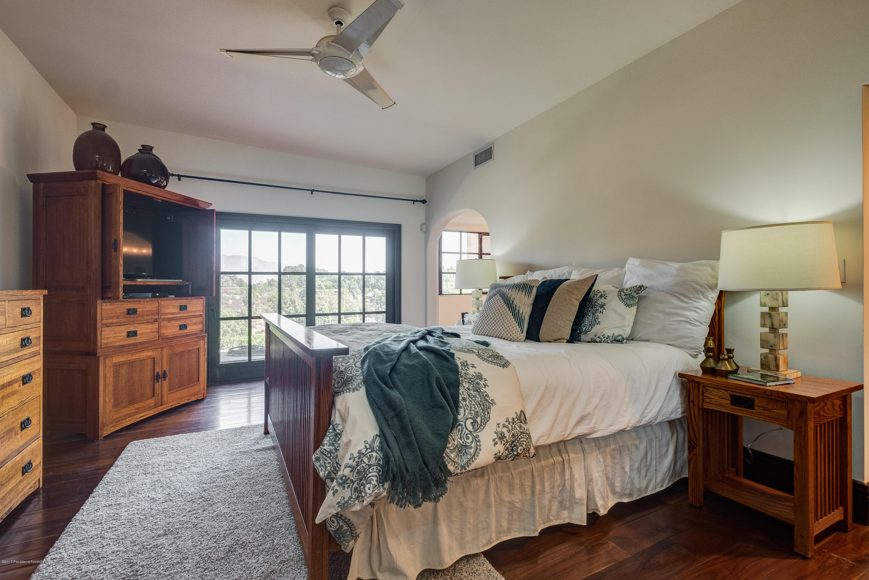 320 Patrician Way Pasadena, CA 91105 - Photo 27 of 69 a bed room with a bed and a chair