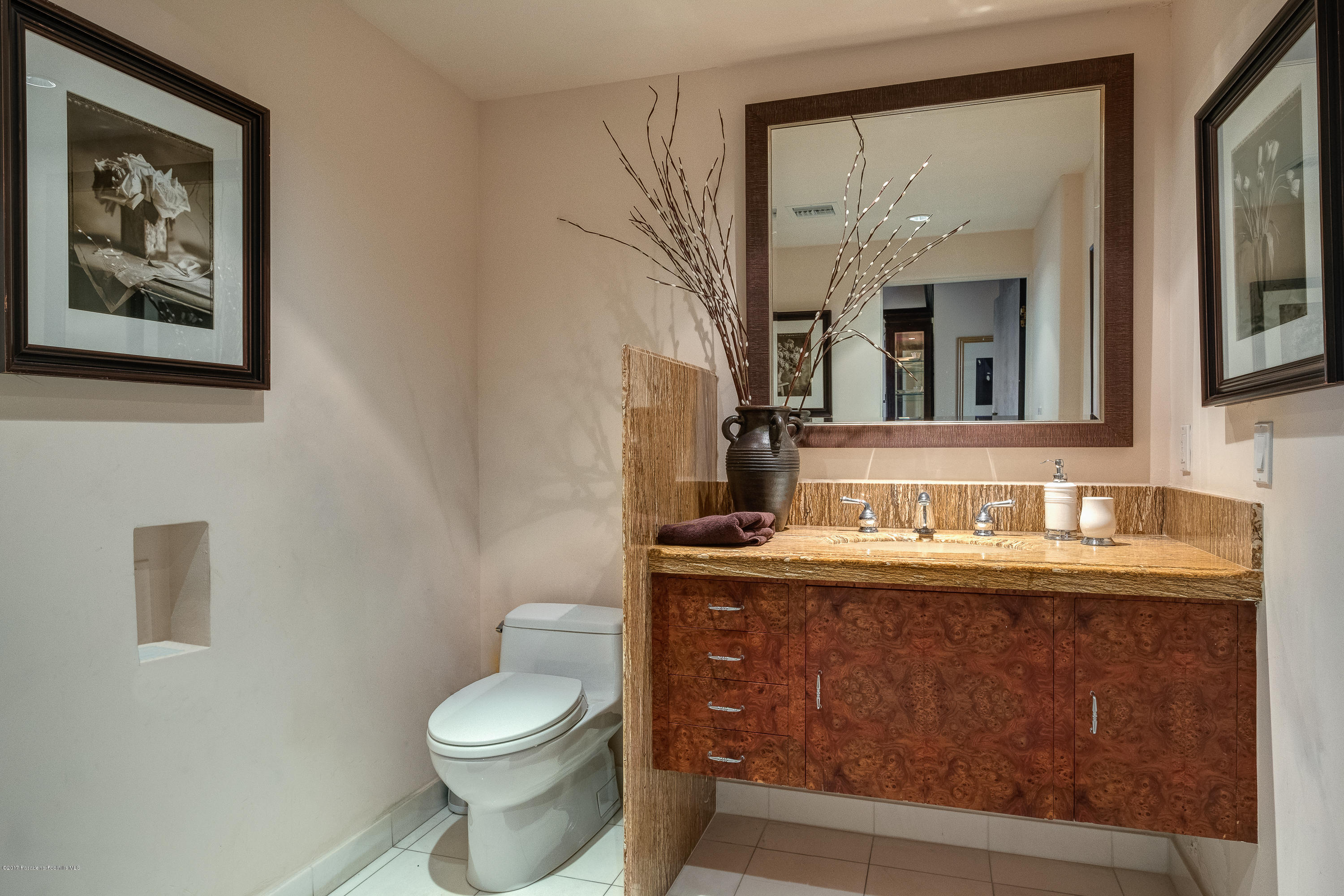 320 Patrician Way Pasadena, CA 91105 - Photo 31 of 69 a bathroom with a toilet a sink and mirror