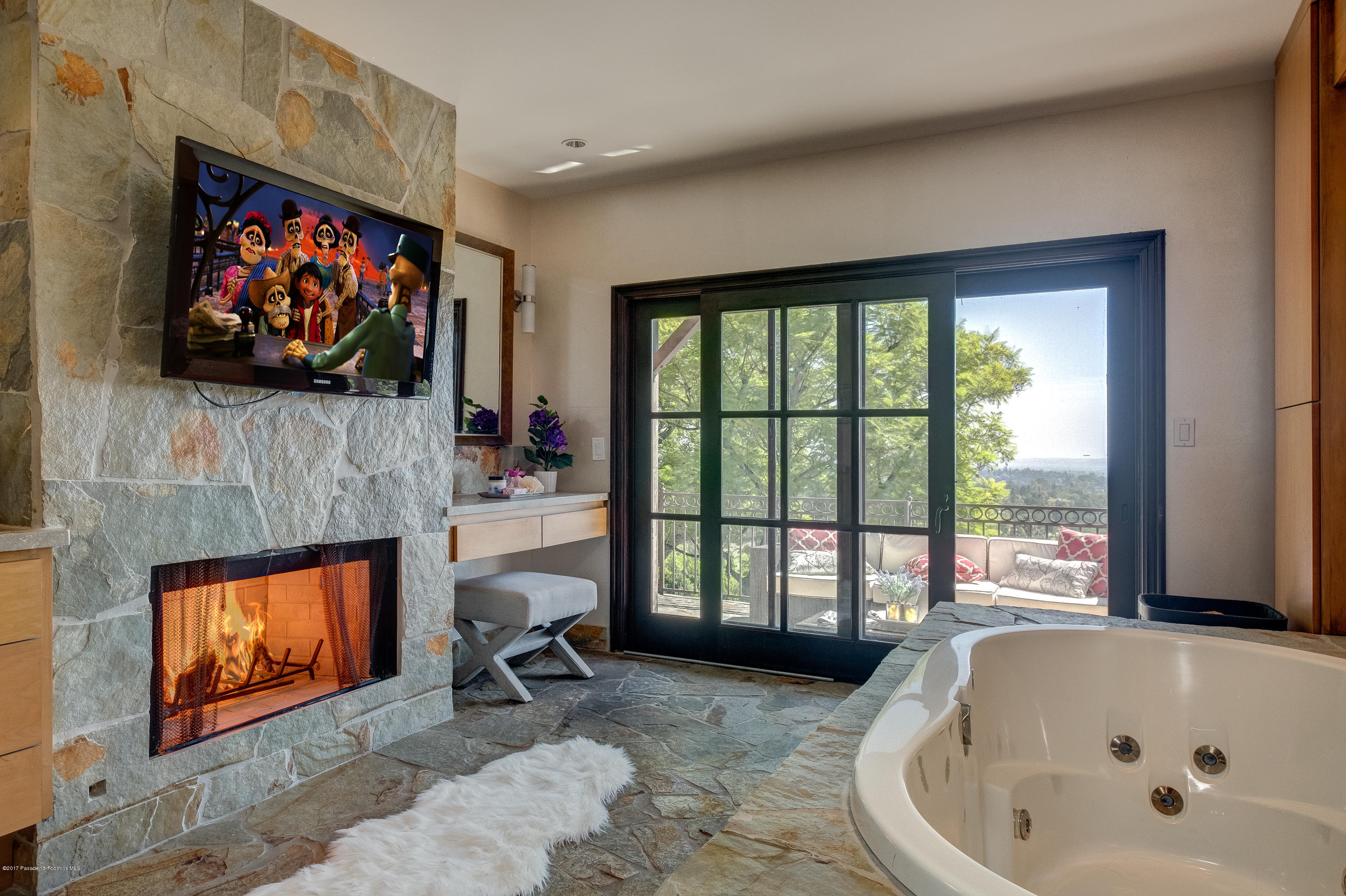 320 Patrician Way Pasadena, CA 91105 - Photo 36 of 69 a living room with fireplace furniture and a flat screen tv