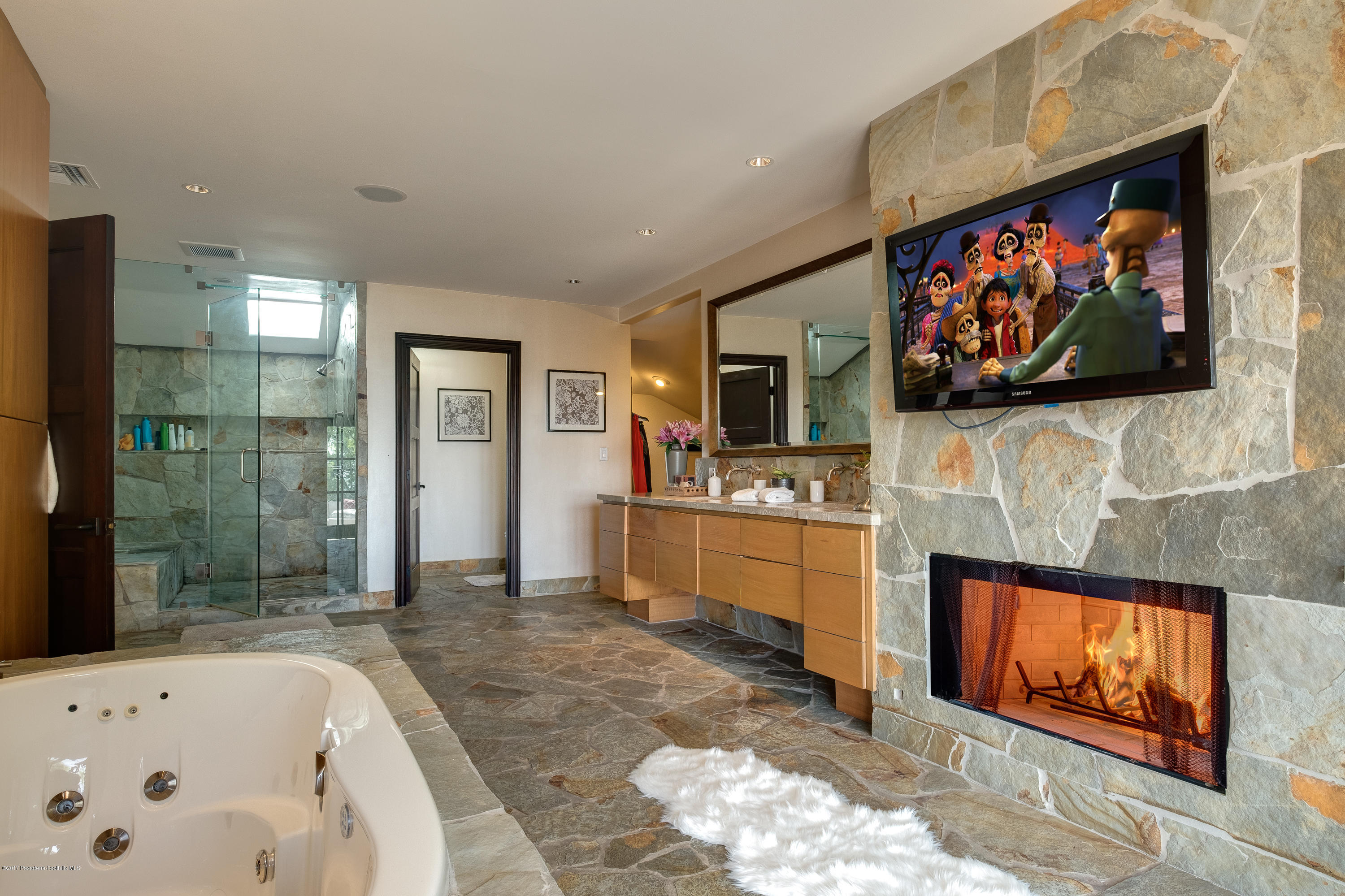 320 Patrician Way Pasadena, CA 91105 - Photo 37 of 69 a spacious bathroom with a bathtub and a window