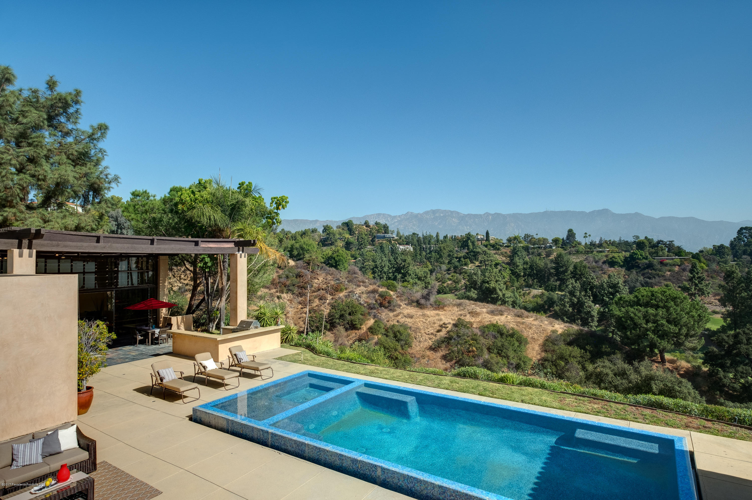 320 Patrician Way Pasadena, CA 91105 - Photo 46 of 69 a view of a backyard with couches potted plants and wooden fence