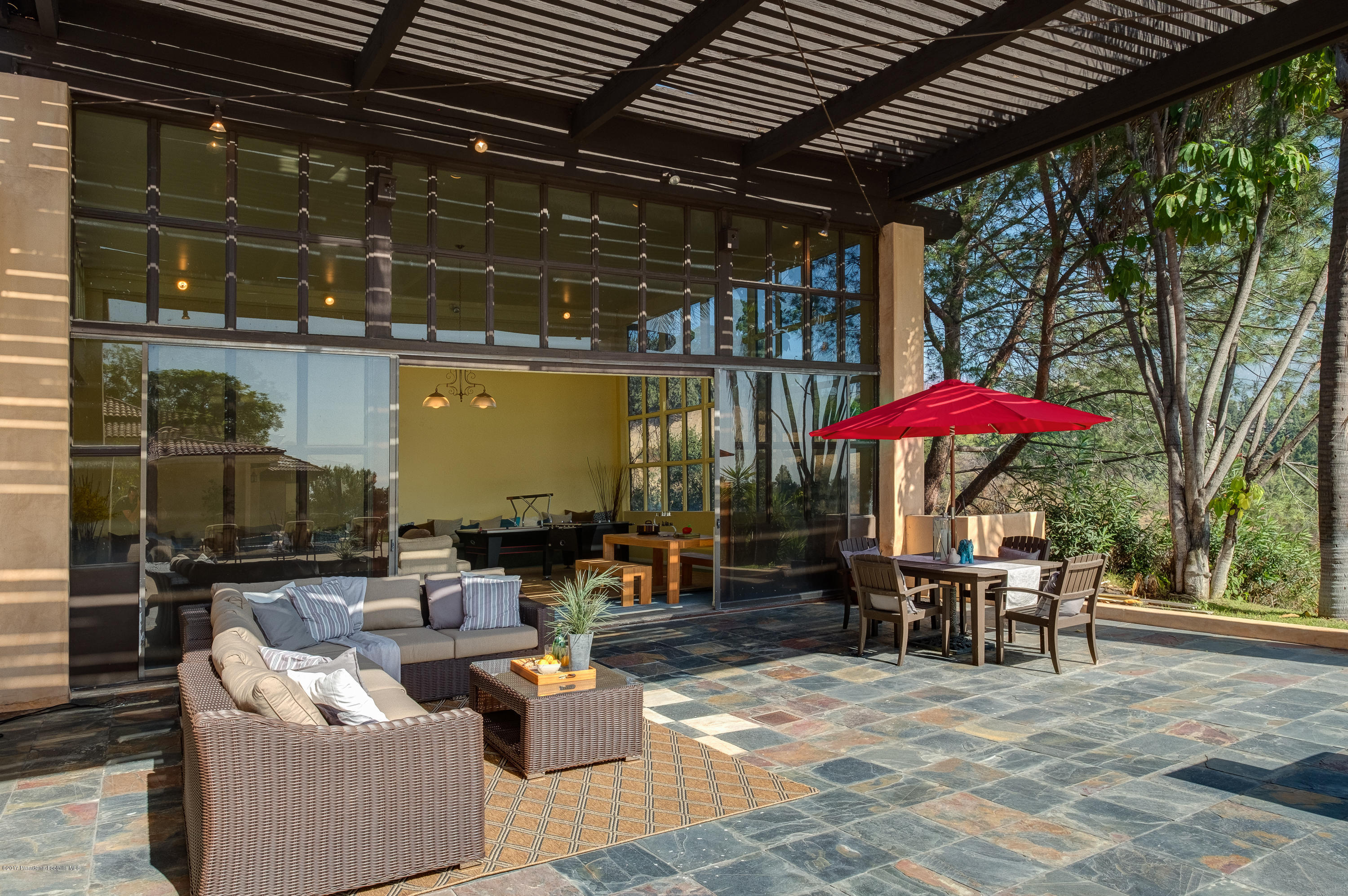 320 Patrician Way Pasadena, CA 91105 - Photo 51 of 69 an outdoor space with patio lots of furniture and umbrella
