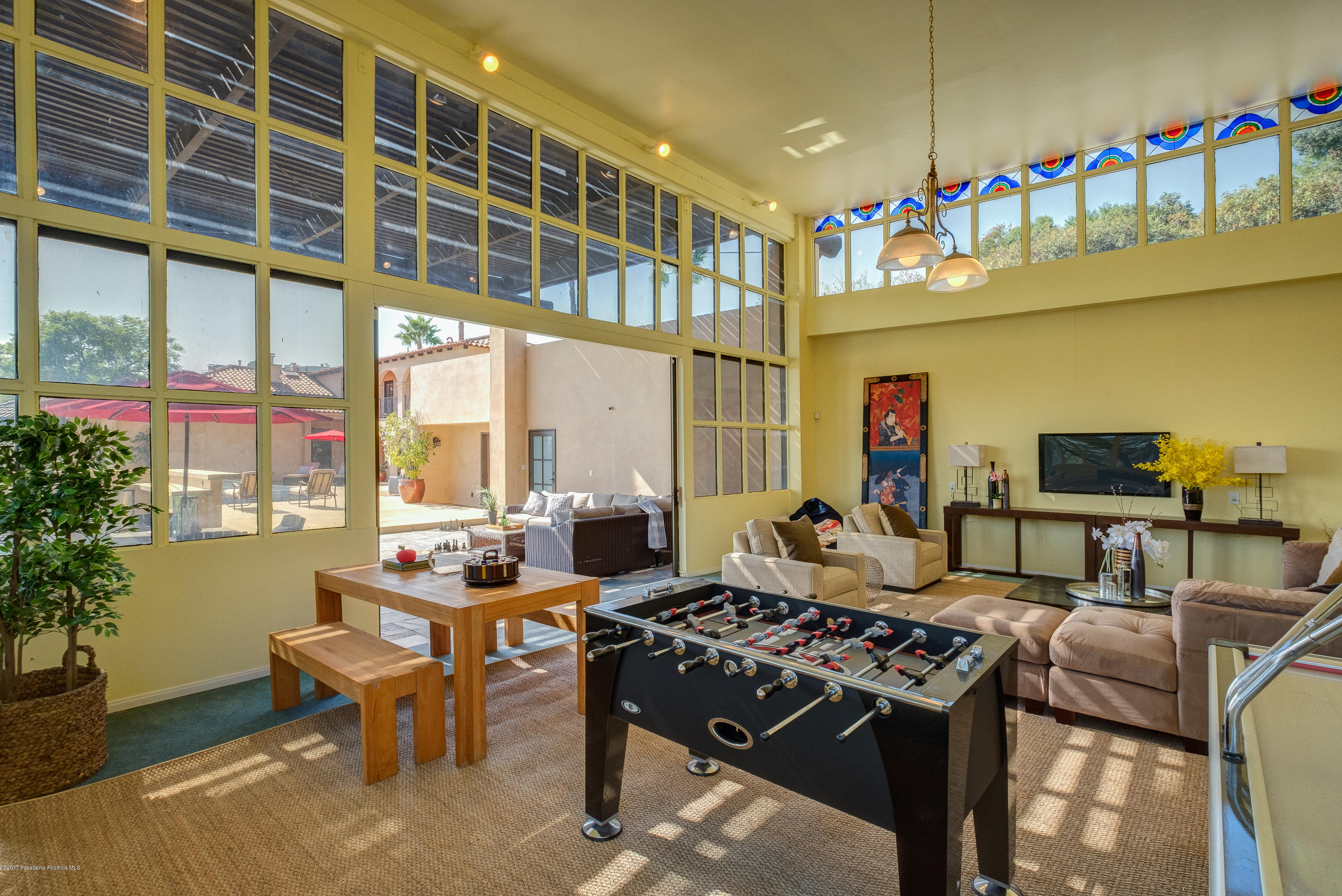 320 Patrician Way Pasadena, CA 91105 - Photo 53 of 69 a living room with furniture and a flat screen tv