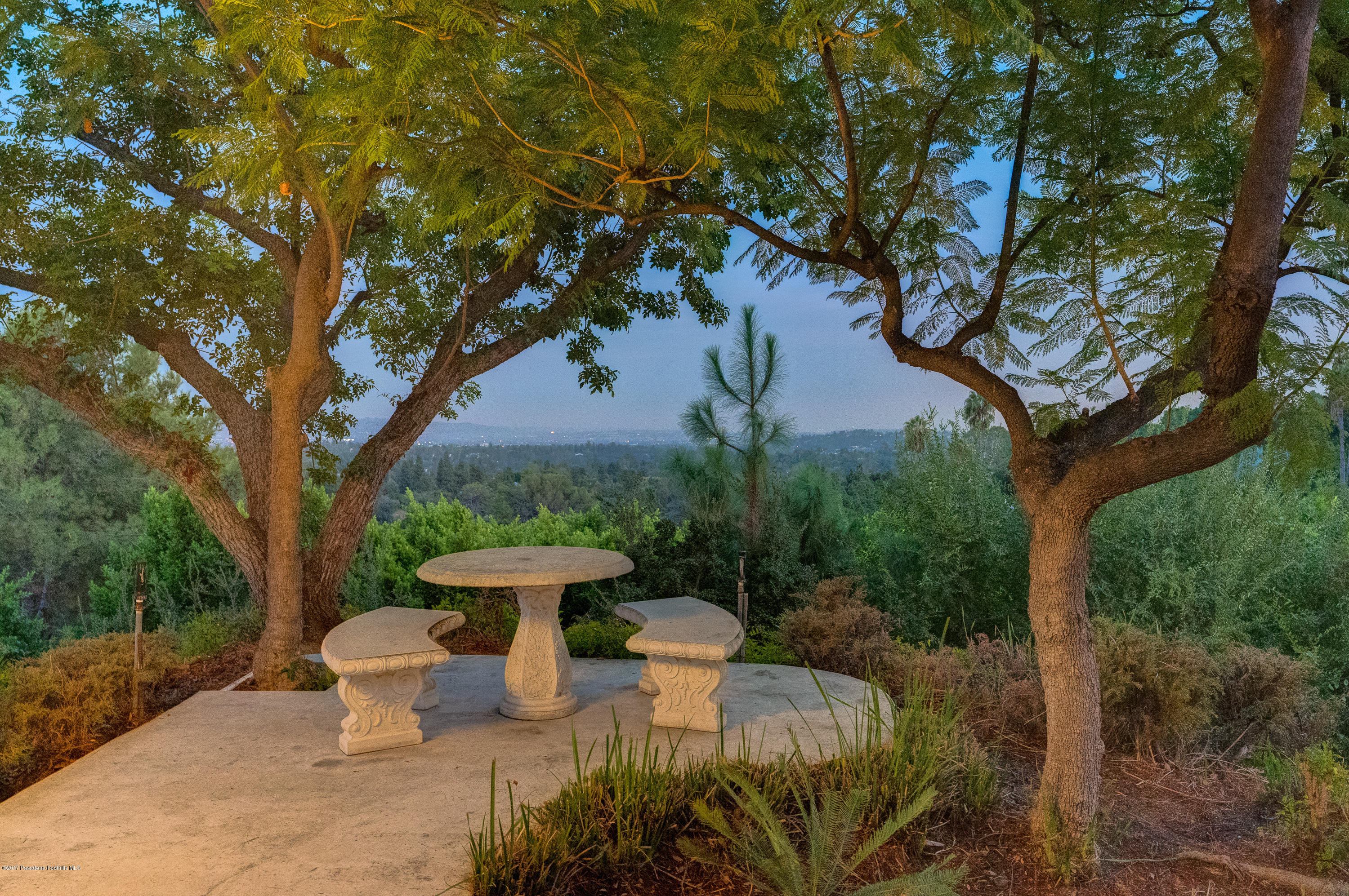 320 Patrician Way Pasadena, CA 91105 - Photo 63 of 69 a view of a backyard with fountain plants and large trees