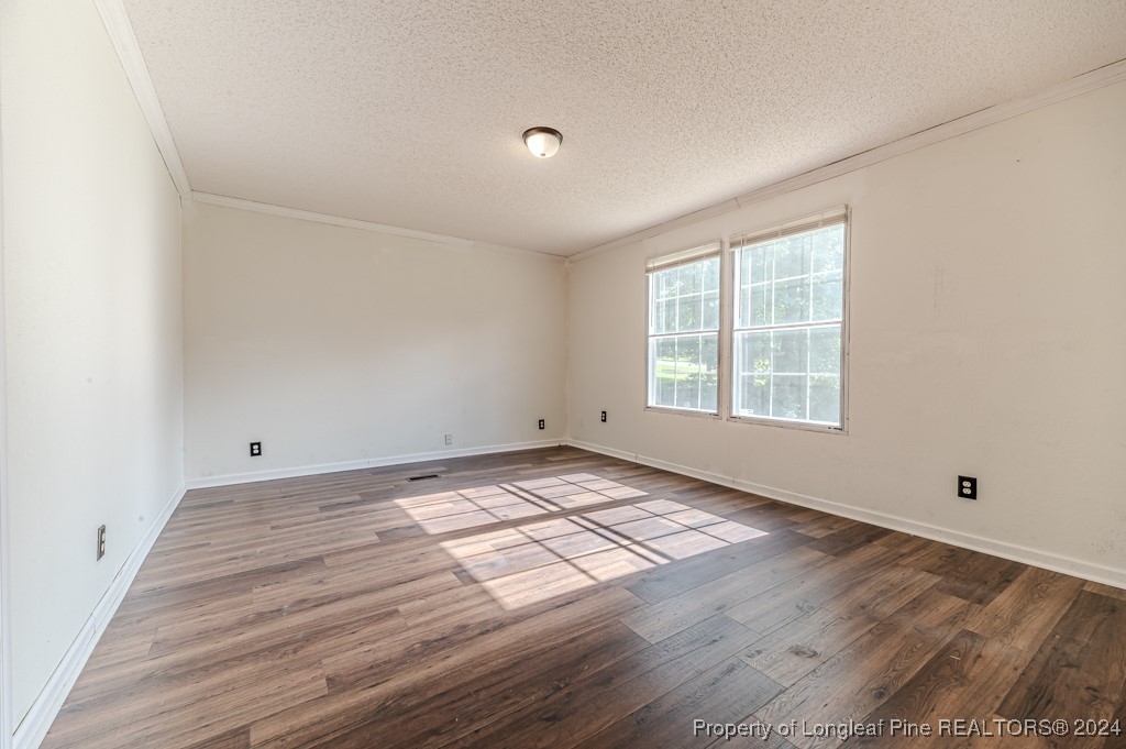 130 Box Elder Terrace Cameron, NC 28326 - Photo 18 of 43 wooden floor in an empty room with a window