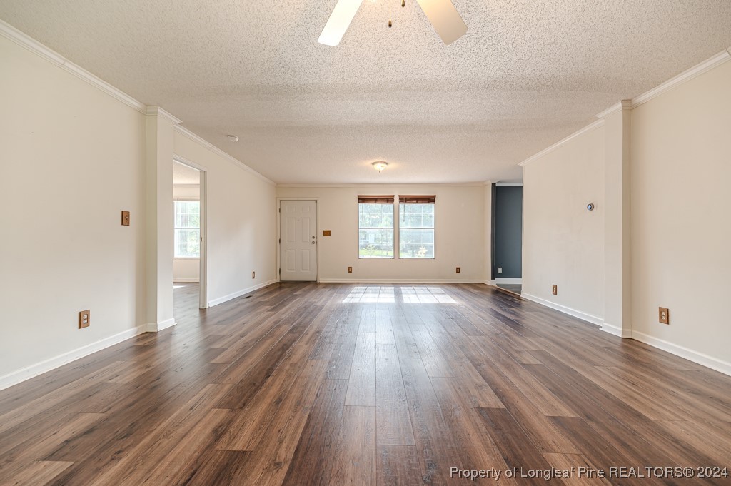 130 Box Elder Terrace Cameron, NC 28326 - Photo 2 of 43 an empty room with wooden floor and windows