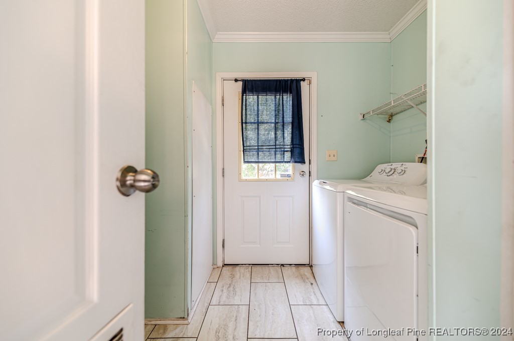 130 Box Elder Terrace Cameron, NC 28326 - Photo 33 of 43 a view of bathroom with a washer and dryer