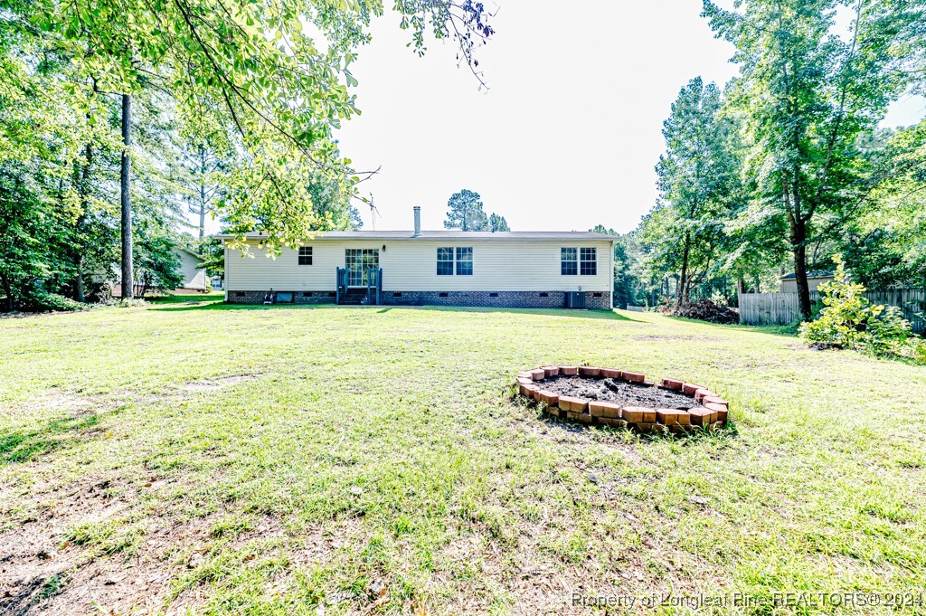130 Box Elder Terrace Cameron, NC 28326 - Photo 35 of 43 a front view of a house with a garden and yard