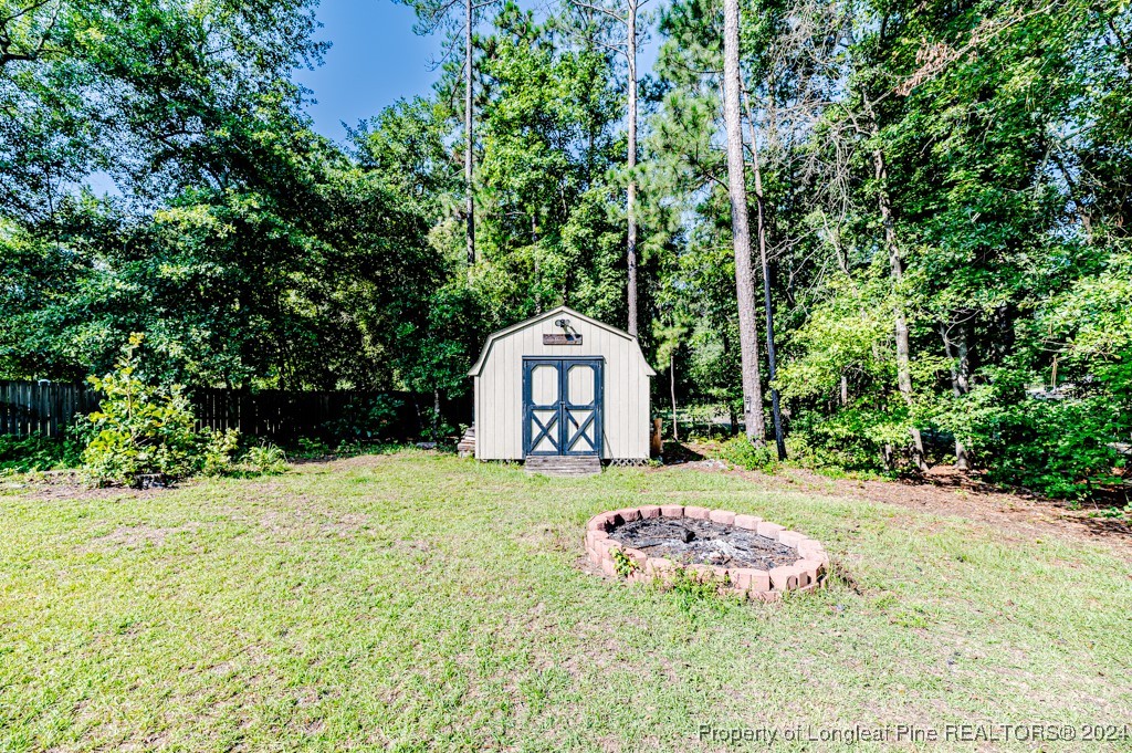 130 Box Elder Terrace Cameron, NC 28326 - Photo 41 of 43 a front view of a house with a yard and garage