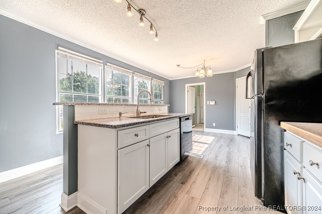 130 Box Elder Terrace Cameron, NC 28326 - Photo 8 of 43 a bathroom with a granite countertop sink mirror and a shower