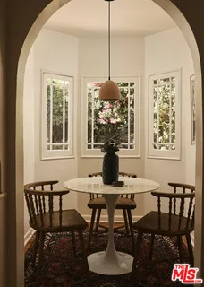 a view of a dining room with furniture window and outside view