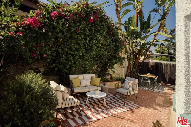 a view of backyard with sitting area