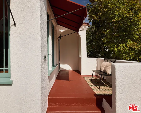 a balcony view with a backyard space
