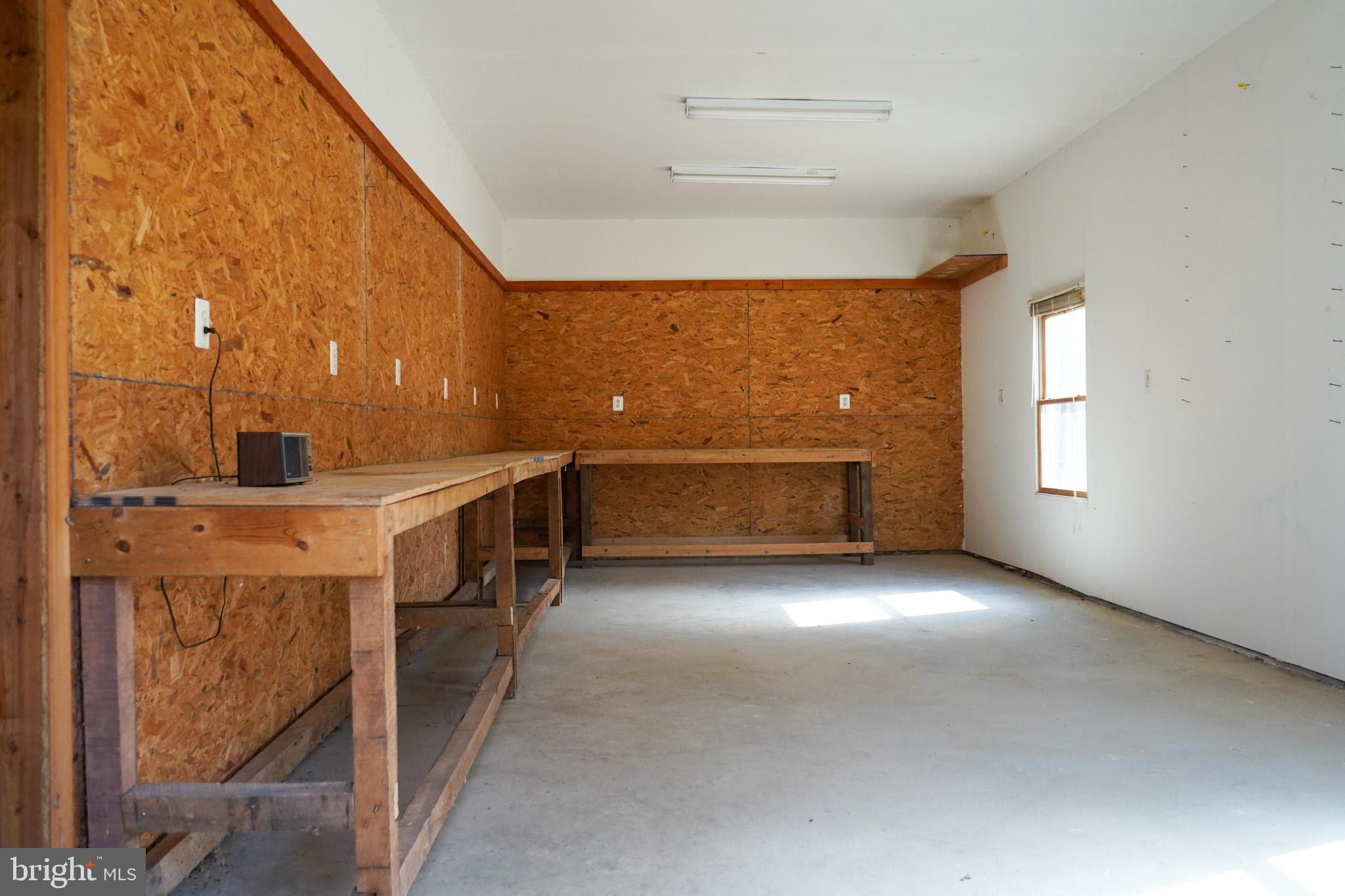 7323 O'Keefe Road Bealeton, VA 22712 - Photo 39 of 48 Spacious workshop with natural light.