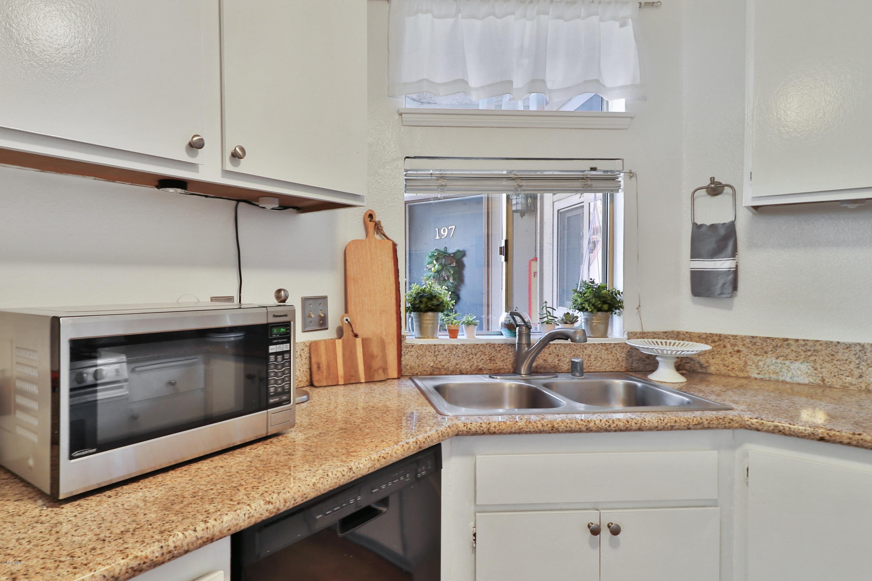 1778 Sinaloa Road, Unit 198 Simi Valley, CA 93065 - Photo 11 of 25 a kitchen with stainless steel appliances granite countertop a sink and cabinets