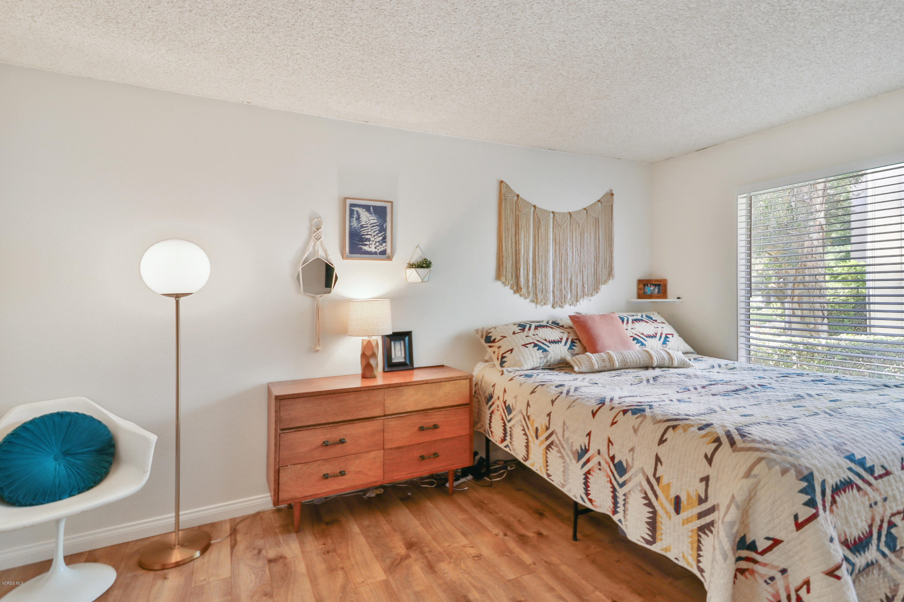 1778 Sinaloa Road, Unit 198 Simi Valley, CA 93065 - Photo 17 of 25 a bedroom with a bed and a painting on the wall