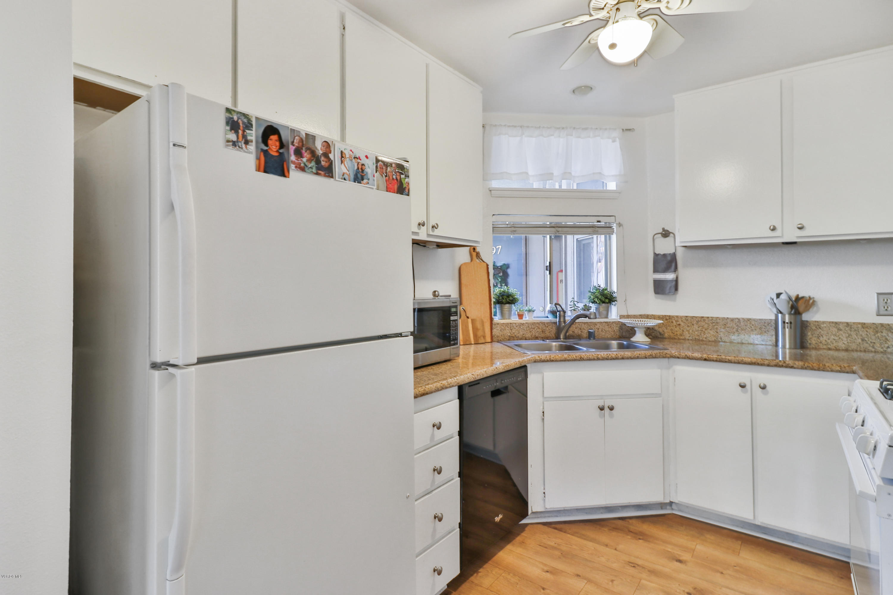 1778 Sinaloa Road, Unit 198 Simi Valley, CA 93065 - Photo 9 of 25 a white refrigerator freezer sitting inside of a kitchen