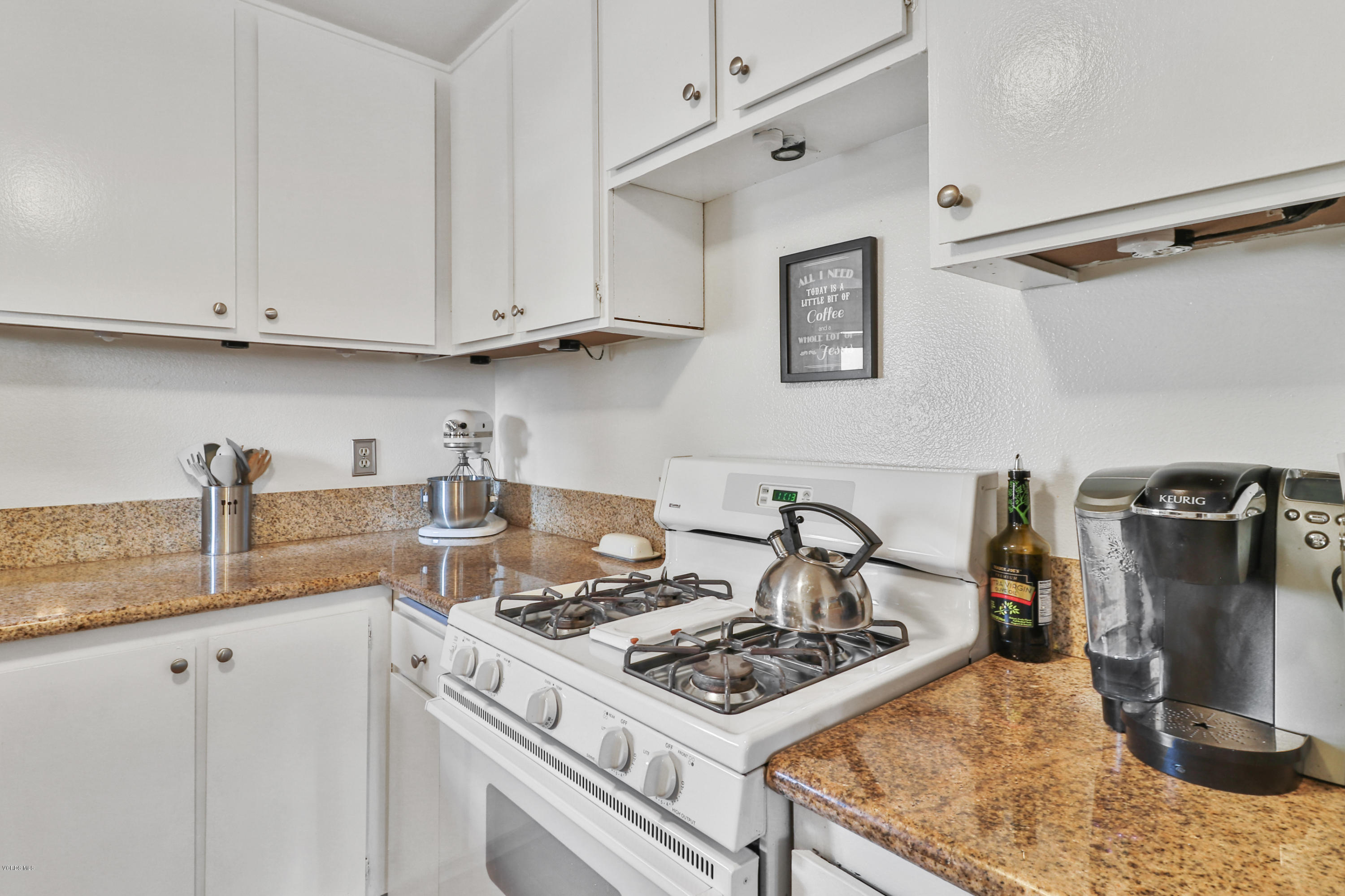 1778 Sinaloa Road, Unit 198 Simi Valley, CA 93065 - Photo 10 of 25 a kitchen with a stove and a sink