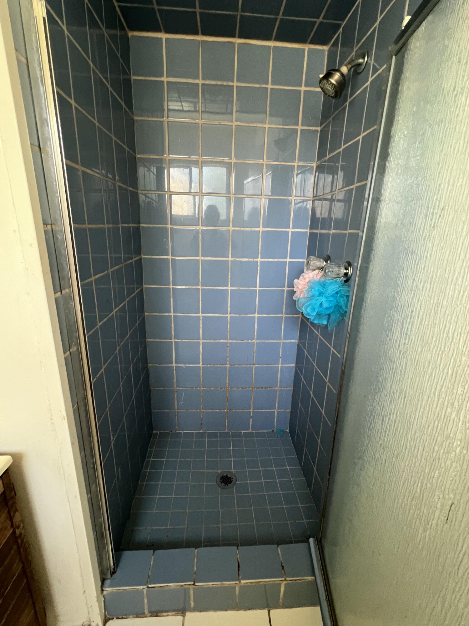 309 V Street Lompoc, CA 93436 - Photo 16 of 24 a bathroom with a shower