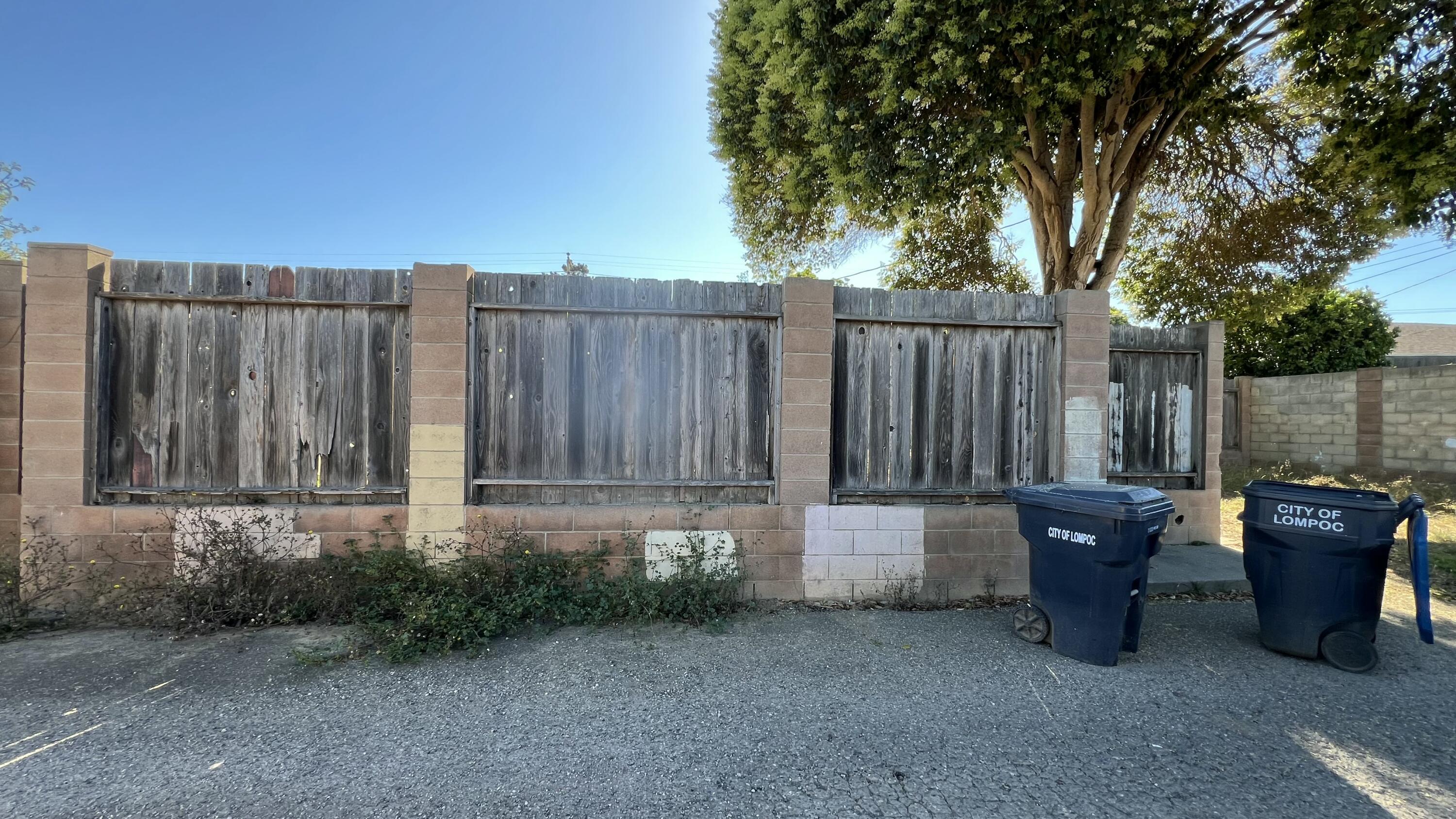 309 V Street Lompoc, CA 93436 - Photo 5 of 24 a view of a backyard with green space