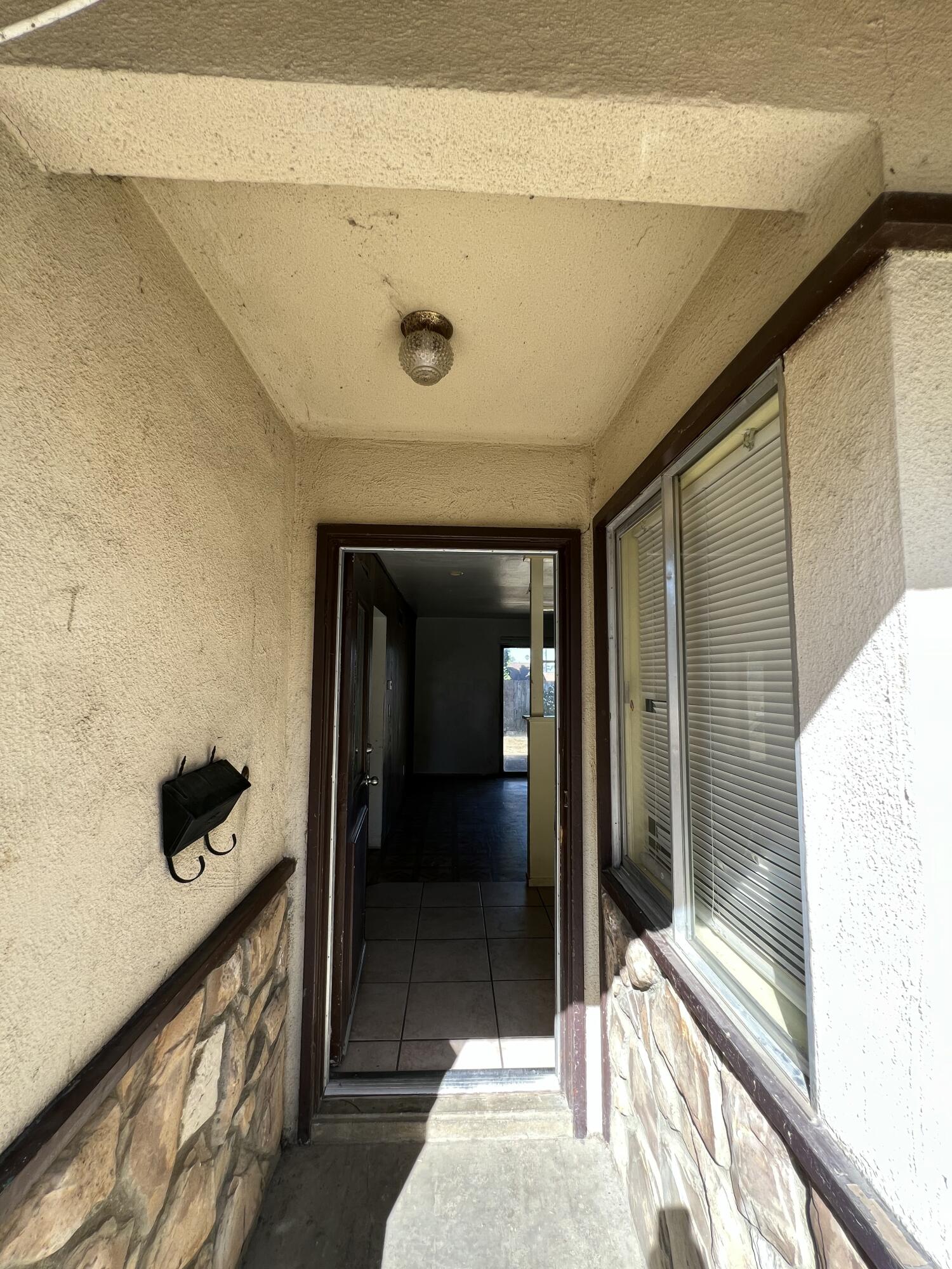 309 V Street Lompoc, CA 93436 - Photo 7 of 24 a view of entryway and hall with wooden floor