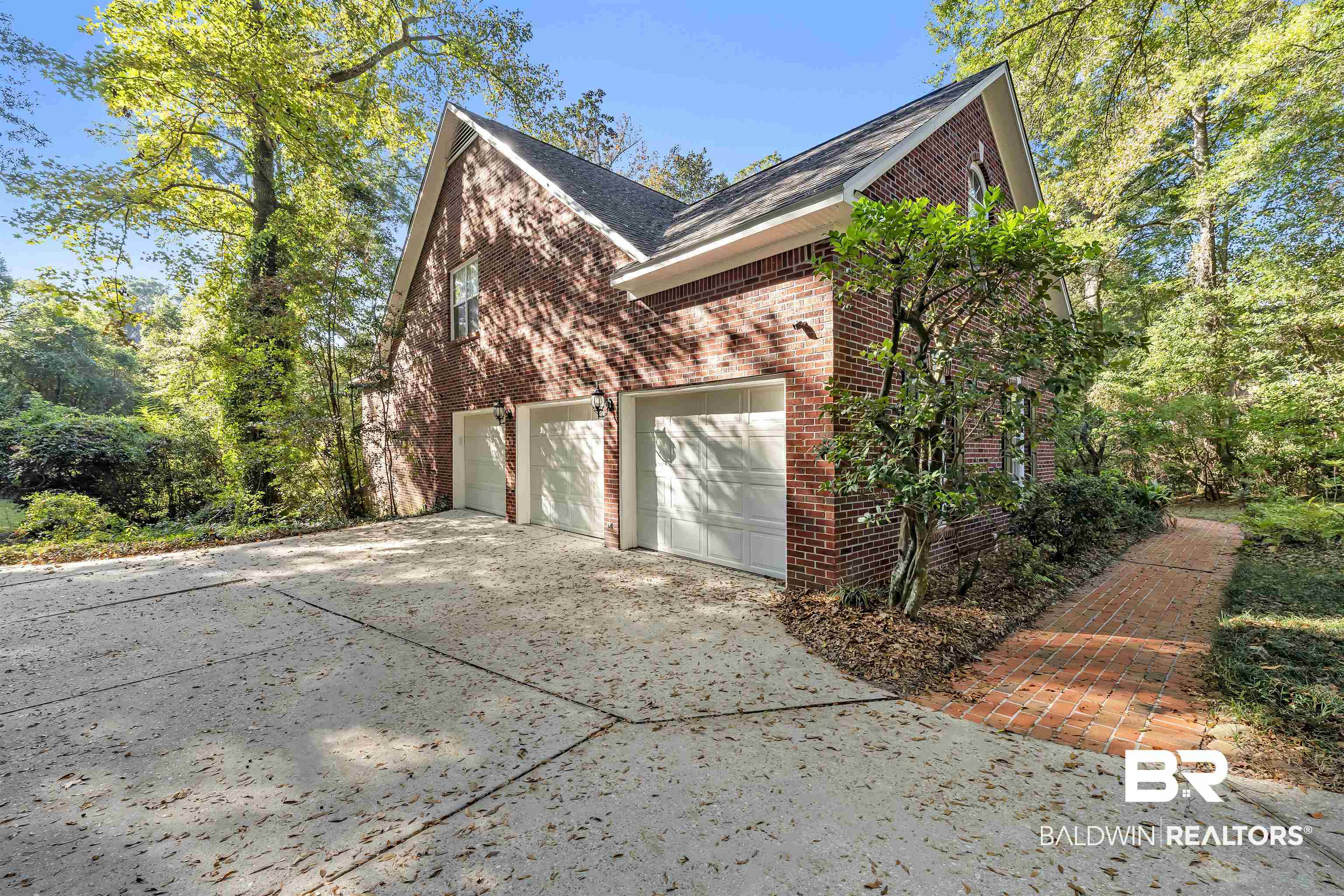 1262 Patrick Street Daphne, AL 36526 - Photo 3 of 35 View of side of home with concrete driveway and brick siding