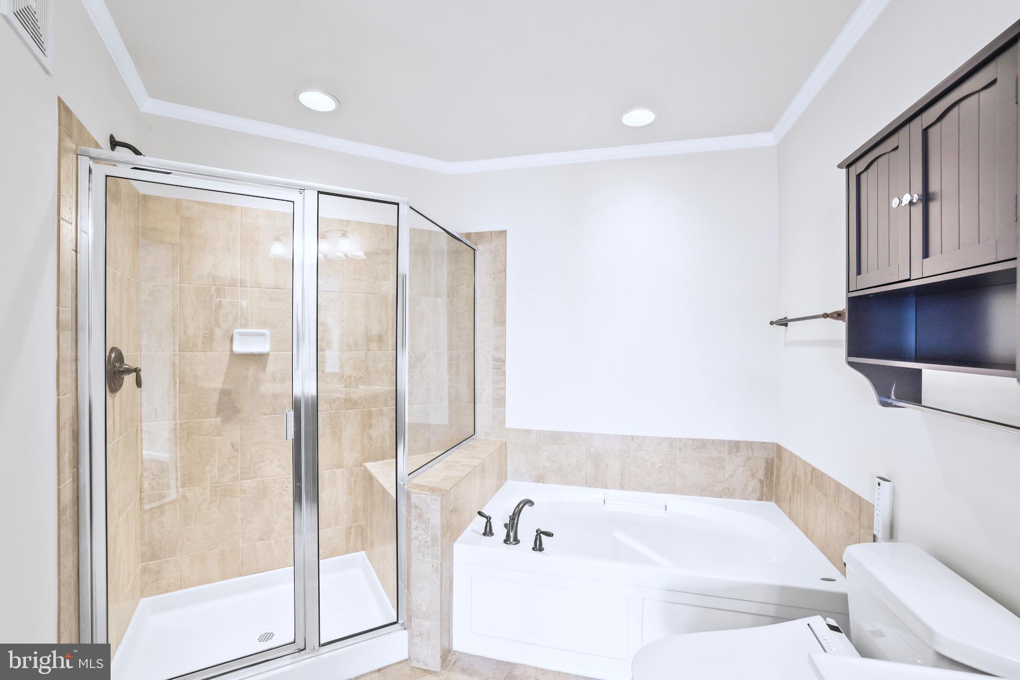6055 Wicker Lane, Unit 128 Centreville, VA 20121 - Photo 21 of 36 a bathroom with a tub shower and sink