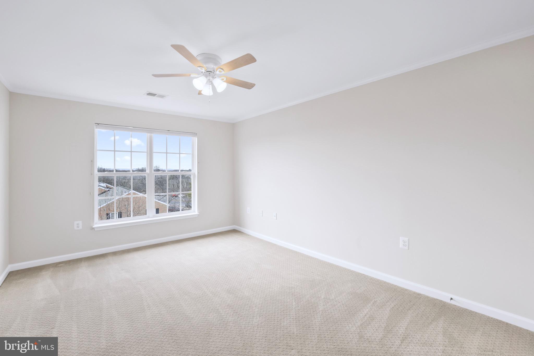 6055 Wicker Lane, Unit 128 Centreville, VA 20121 - Photo 24 of 36 a view of an empty room with a window