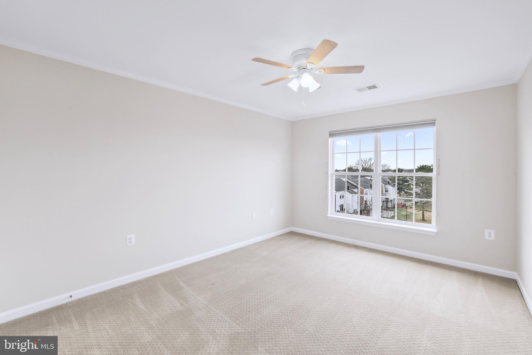 6055 Wicker Lane, Unit 128 Centreville, VA 20121 - Photo 28 of 36 an empty room with windows and fan