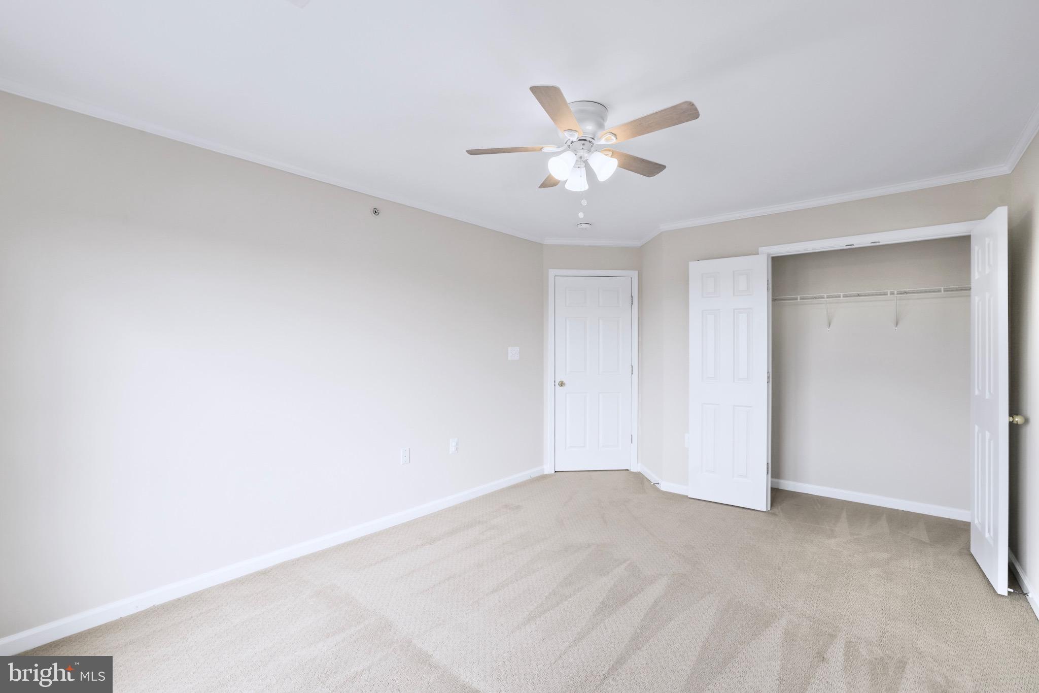 6055 Wicker Lane, Unit 128 Centreville, VA 20121 - Photo 29 of 36 a view of a big room with closet and chandelier fan