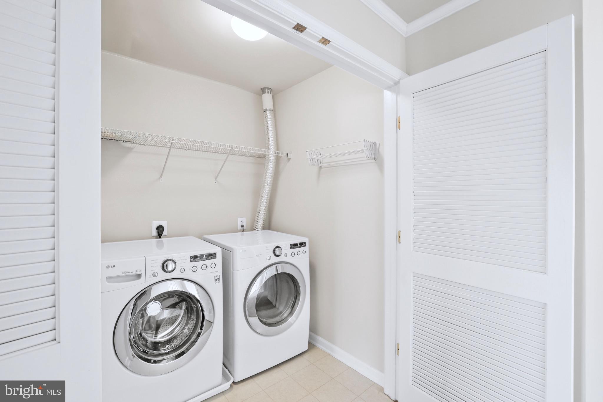6055 Wicker Lane, Unit 128 Centreville, VA 20121 - Photo 31 of 36 a utility room with dryer and washer