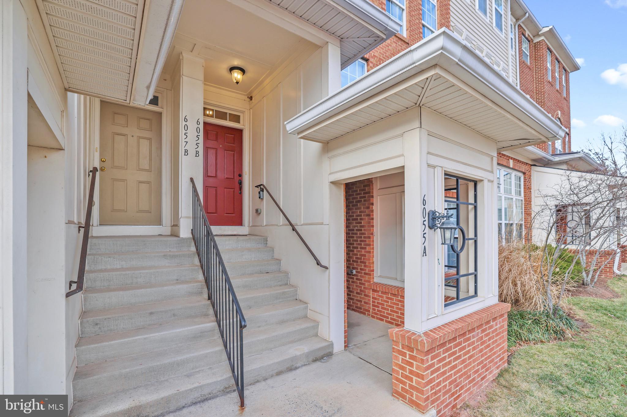 6055 Wicker Lane, Unit 128 Centreville, VA 20121 - Photo 34 of 36 a front view of a house with wooden fence and windows