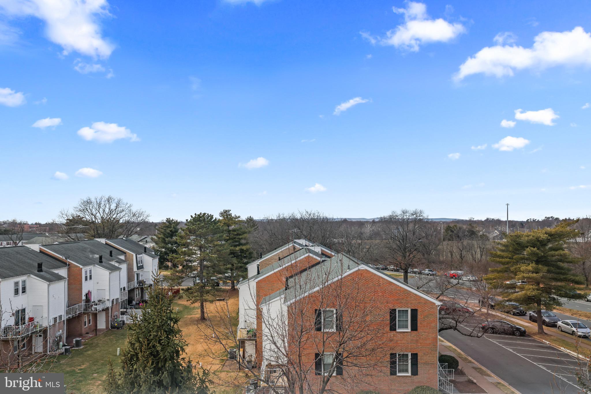 6055 Wicker Lane, Unit 128 Centreville, VA 20121 - Photo 35 of 36 a view of a house with a big yard